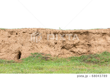 Layers of soil with green grass growing isolated 68043789