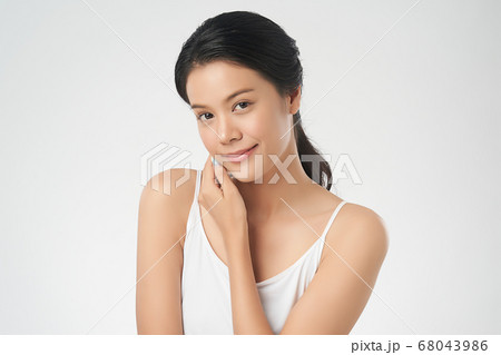 Beautiful Young asian Woman with Clean Fresh Skin, Face care, Facial treatment. Cosmetology, beauty Beautiful Young asian Woman with Clean Fresh Skin, Face care, Facial treatment. Cosmetology, beauty 68043986