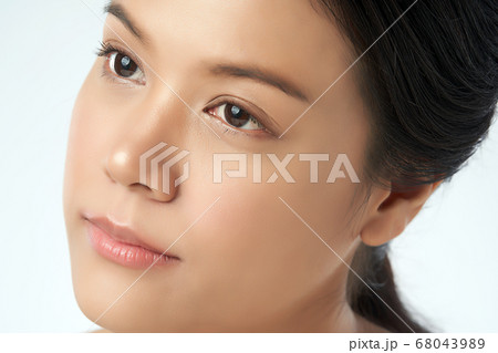 close up Beautiful Young asian Woman with Clean Fresh Skin, Face care, Facial treatment. Cosmetology close up Beautiful Young asian Woman with Clean Fresh Skin, Face care, Facial treatment. Cosmetology 68043989