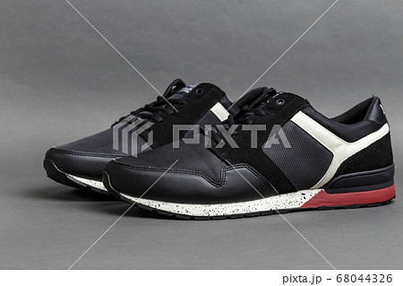 black sneakers on a gray background 68044326