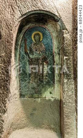 Gumusler Monastery from inside. Sacred Frescos on the wall of the Cave Church in Cappadocia Gumusler Monastery from inside. Sacred Frescos on the wall of the Cave Church in Cappadocia 68044423