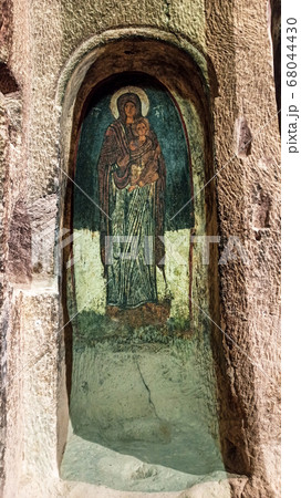 Gumusler Monastery from inside. Sacred Frescos on the wall of the Cave Church in Cappadocia Gumusler Monastery from inside. Sacred Frescos on the wall of the Cave Church in Cappadocia 68044430