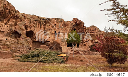 Ancient and secret Gumusler ruins and the monastery surrounded by walls and stones in Cappadocia, Gumusler, Nigde Ancient and secret Gumusler ruins and the monastery surrounded by walls and stones in Cappadocia, Gumusler, Nigde 68044647