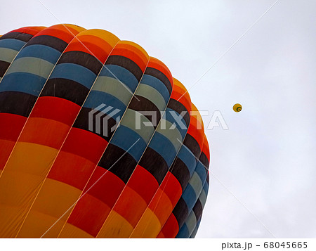 Colorful hot air balloons flying at the sunrise with rocky landscape in Cappadocia, Turkey Colorful hot air balloons flying at the sunrise with rocky landscape in Cappadocia, Turkey 68045665
