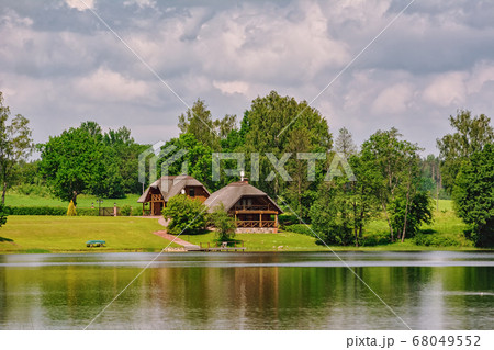 Houses on the bank of the river 68049552