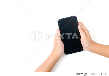 Child hand holding black smartphone with black Child hand holding black smartphone with black 68050164