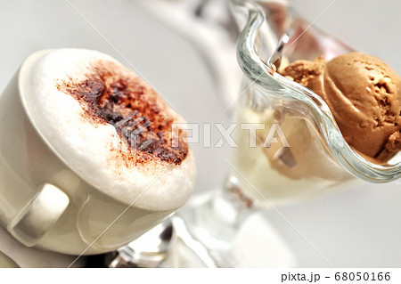 Cup of cappuccino with milk foam sprinkled with 68050166