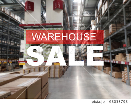The word WAREHOUSE SALE is clearly written against the background of an image of a department store in a large warehouse. The image has been blurred. 68053798