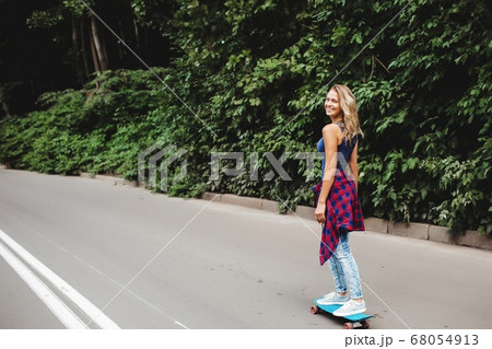 beautiful blonde skates in the park beautiful blonde skates in the park 68054913