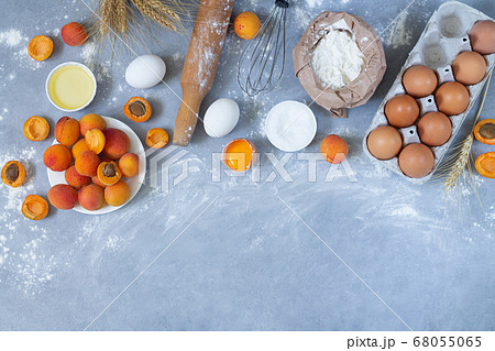 Raw ingredients for cooking apricot pie. Bakery background top view Raw ingredients for cooking apricot pie. Bakery background top view 68055065