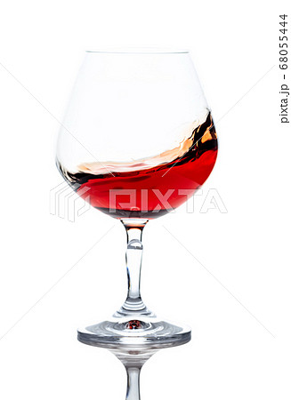 Snifter of brandy isolated on white background. Snifter of brandy isolated on white background. 68055444