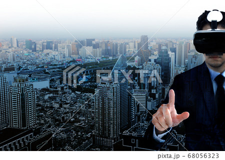 asian man with VR glass pointing on graphic and asian man with VR glass pointing on graphic and 68056323