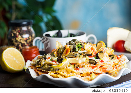 Seafood pasta with mussels and parmesan cheese on 68056419