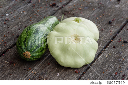 Zucchini and two pattypan squash harvested from the vegetable garden beds 68057549