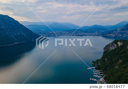 Aerial view over the Lake Lugano in Switzerland - evening view 68058477