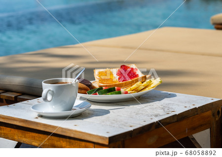 Delicious breakfast on the swimming pool in luxury resort 68058892