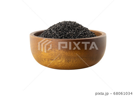 side view of black sesame seeds in wooden bowl side view of black sesame seeds in wooden bowl 68061034