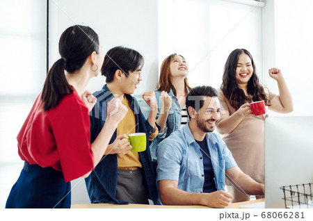 Excited group business people feeling euphoric celebrating online win success achievement result Excited group business people feeling euphoric celebrating online win success achievement result 68066281
