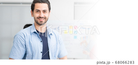 Young man owner startup business and looking at camera with smile Young man owner startup business and looking at camera with smile 68066283