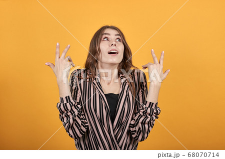 Surprised Girl Reacts In Shock To The Situation, Raised Her Hands Surprised Girl Reacts In Shock To The Situation, Raised Her Hands 68070714