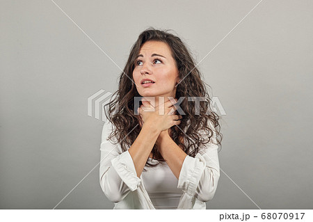 Hands around throat, screaming, panicking in trouble as chokes on food stuck 68070917