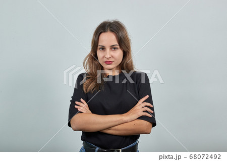 Stylish Girl Clasped Her Hands And Confidently Looks Forward Stylish Girl Clasped Her Hands And Confidently Looks Forward 68072492