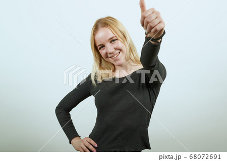 Happy Girl Smiling Raised Her Thumb Up 68072691