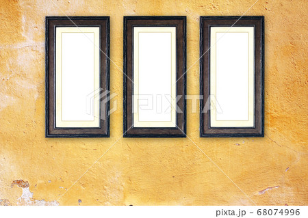 Three empty picture frames on old stucco wall Three empty picture frames on old stucco wall 68074996
