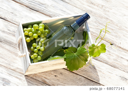 White wine on wooden white vintage table White wine on wooden white vintage table 68077141