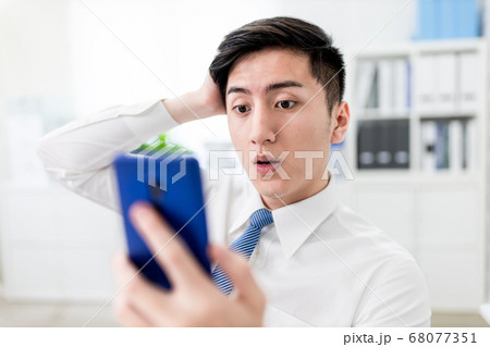 businessman look fake news 68077351