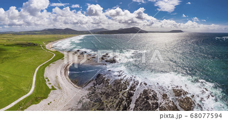 Aerial view of the beautiful coast next to Carrickabraghy Castle - Isle of Doagh, Inishowen, County Donegal - Ireland 68077594