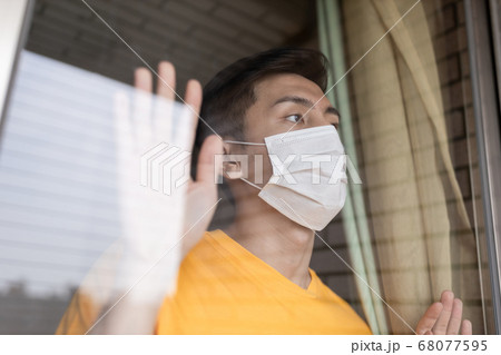 asian man is self quarantine 68077595