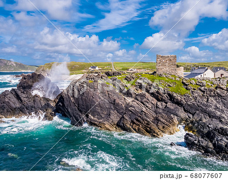 Aerial view of the beautiful coast next to Carrickabraghy Castle - Isle of Doagh, Inishowen, County Donegal - Ireland 68077607