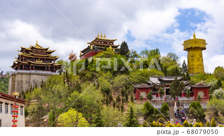 Giant tibetan prayer wheel and Zhongdian temple - Yunnan, China 68079050