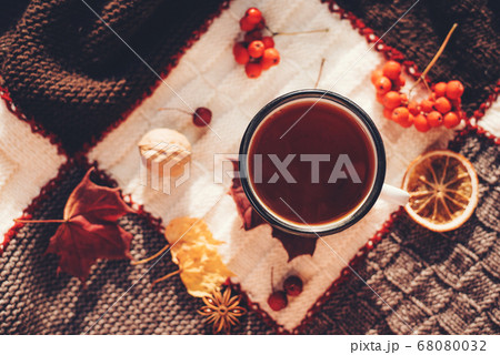 Autumn hot steaming cup of coffee or tea. 68080032