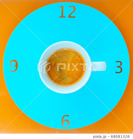 Coffee cup  arranged as clock face on blue 68081326