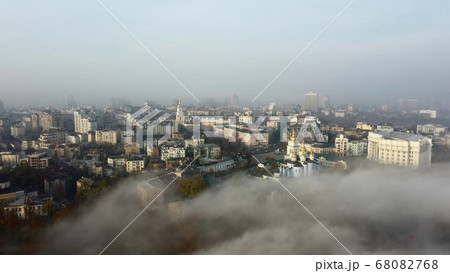 Aerial view of the city in the fog. 68082768