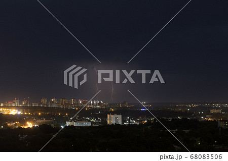 Two lightning flashes in the sky above the city Two lightning flashes in the sky above the city 68083506