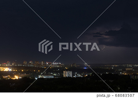 Lightning flashes in the sky above the city Lightning flashes in the sky above the city 68083507