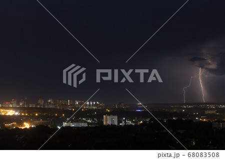 Lightning bolt strike the ground in the city Lightning bolt strike the ground in the city 68083508