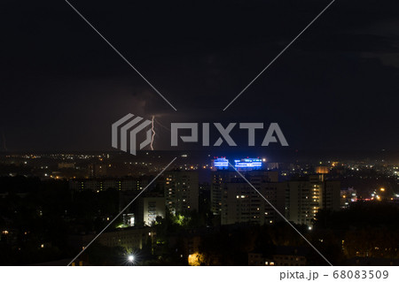 Thick lightning bolt strike the ground in the city Thick lightning bolt strike the ground in the city 68083509