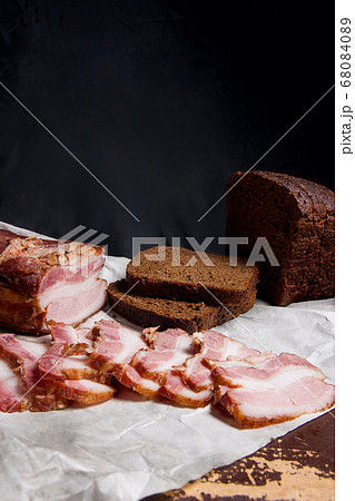 Puff smoked bacon with rye black bread on the 68084089
