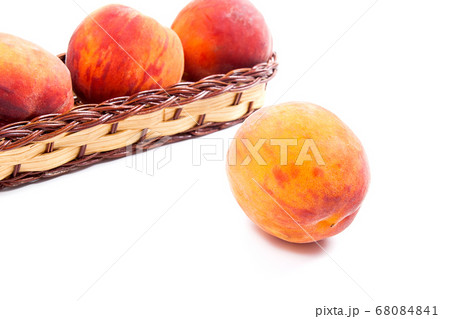 Single ripe peach fruit and several in basket Single ripe peach fruit and several in basket 68084841