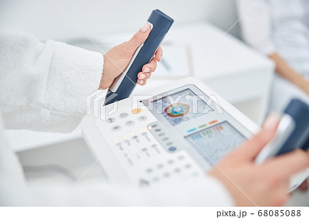 Portrait of woman hands on the modern technology device that showing indicators of the health Portrait of woman hands on the modern technology device that showing indicators of the health 68085088