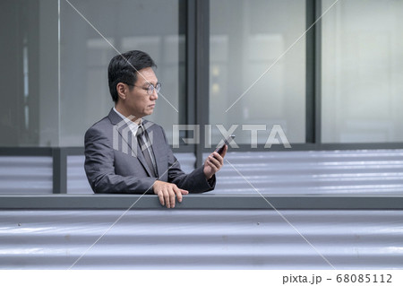 Chinese businessman in business suit and tie Chinese businessman in business suit and tie 68085112