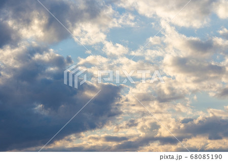 clouds in yellow sunset light. blue sky background clouds in yellow sunset light. blue sky background 68085190