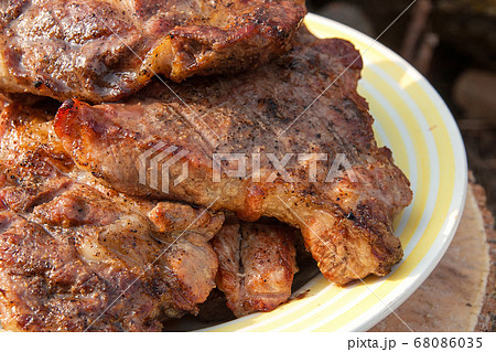 Close up view of juicy pork steak cooked on an 68086035