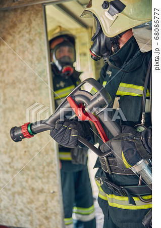 Photo of man working in protective uniform in the indoors 68086777