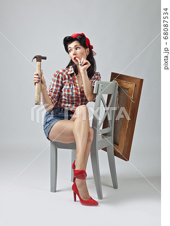 Girl with hammer . Girl with hammer . 68087534