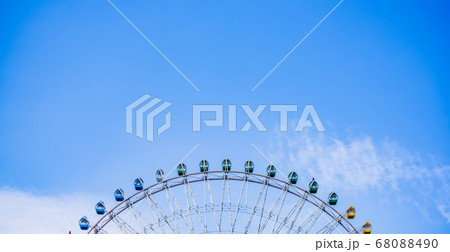 Partial view of a large ferris wheel with Partial view of a large ferris wheel with 68088490